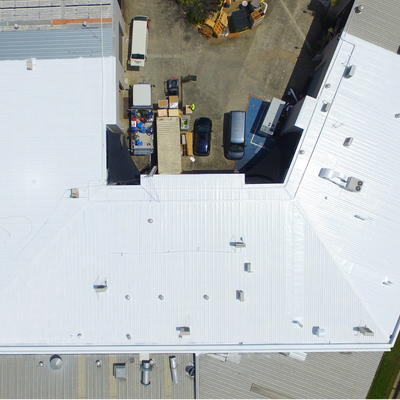 rusty-leaking-roof-waterproof-thermal-top-coat-applied-to-commercial-roof-1