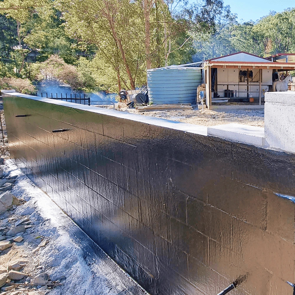 Before and After application of waterproof sealant on a retaining wall